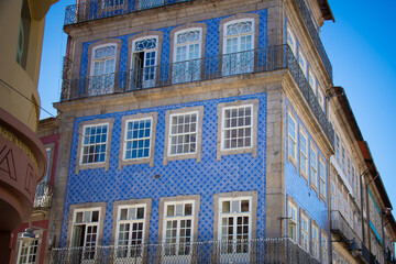 Braga, Portugal - Traditional blue-tiled building in the city center with wrought-iron balconies.