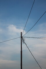 low angle view of electric pole with natural sky background