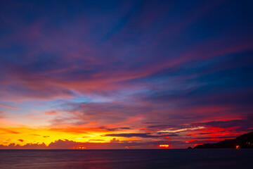 Landscape of colorful clouds in sunset or sunrise sky over sea with reflection in the tropical sea,Beautiful seascape scenery,Amazing light of nature Landscape nature background