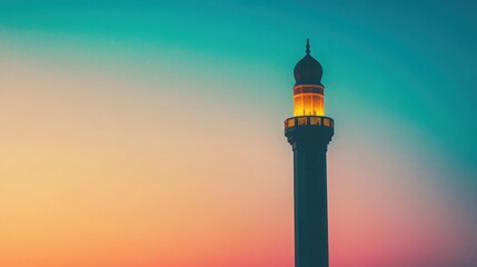 Silhouette of a mosque minaret against a vibrant sunset sky, showcasing rich colors and peaceful atmosphere