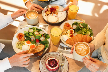 Women having tasty breakfast in cafe, closeup