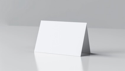 Blank Tent Card Mockup: A clean, minimalist image showcasing a blank tent card, perfect for displaying your design or message. The card is angled slightly, creating a dynamic visual.