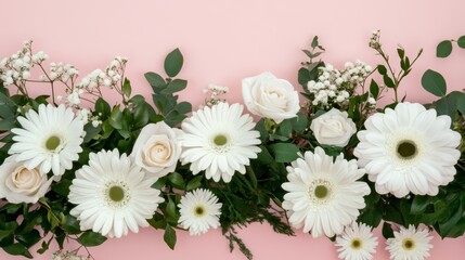 Fototapeta premium Delicate arrangement of white flowers with greenery on a soft pink background for a celebration or decoration