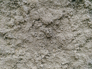 The texture of the wall is covered with cement. Concrete wall cement texture background gray color. Cement texture on the wall surface; textured cement covered wall background