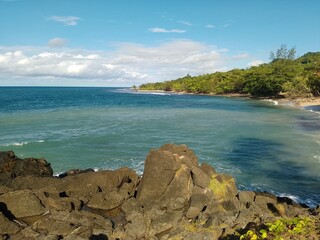 view on the beach when standing on a rock located on the coast
