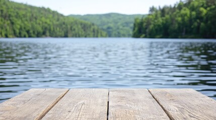 Wooden dock overlooking a lake, calm waters, green forest.  Suitable for product display, promotional images, or tourism