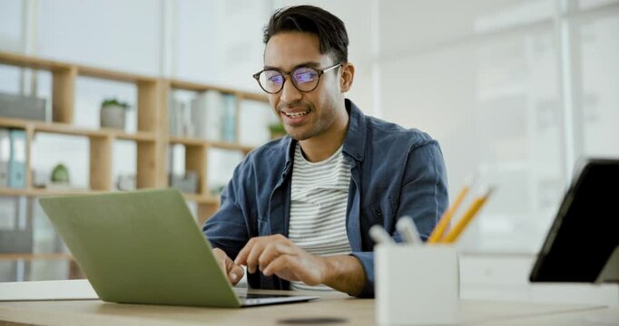 Laptop, smile and celebration of businessman at desk with glasses, success or professional achievement. Office, winning or happy man with positive online feedback, creative review or website report
