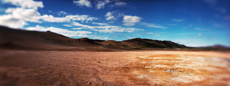 Panoramic view of Hverir, a geothermal area known for its bubbling pools of mud & steaming fumaroles emitting sulfuric gas, Namafjall, Iceland.