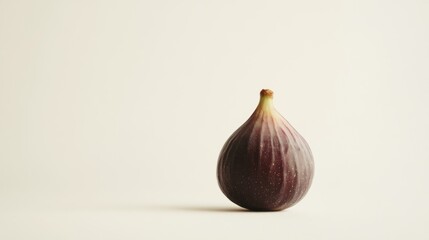 Obraz premium Single ripe fig on white background, minimalist food photography, recipe website