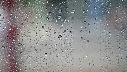 Raindrops on the glass, focus selected