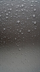 Raindrops on the glass, focus selected