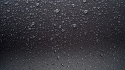 Raindrops on the glass, focus selected
