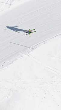 Aerial drone view of a ski resort in Col dei Baldi, Alleghe, in the Dolomites, Italy in daylight. Vertical