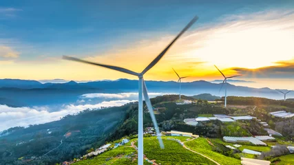 Fototapete Rund Aerial view dawn on the Da Lat plateau, Vietnam. Below are tea hills and wind turbines, a peaceful land for weekend travel © huythoai