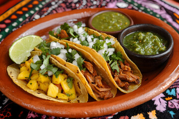 Mexican street tacos al pastor with grilled pork, pineapple, and fresh cilantro