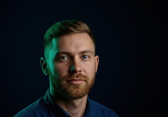Obraz premium Man with beard in dramatic lighting portrait