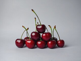 Pile of Red Cherries on White Background