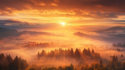 Fototapeta premium Majestic sunrise over misty mountain valley.