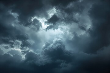 Obraz premium Dark storm clouds fill the sky, illuminated by light breaking through, creating a moody atmosphere. Background for weather or nature concept. Ai generative