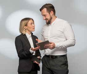 professional people businessmen lawyers discuss plan use tablet smartphone. colleagues subordinate and boss discuss decide study . businessmen businesswoman in business clothes use