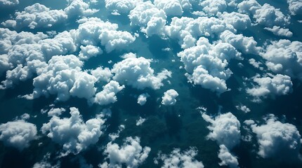 Fototapeta premium Aerial View of White Clouds Over Dark Green Terrain Landscape
