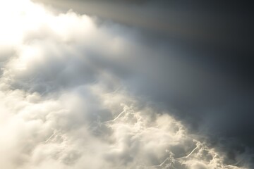 Obraz premium Dramatic Clouds and Sunlight Creating a Sky Scene with Contrasting Light