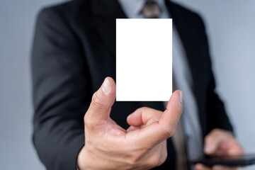 Businessman hand holding blank white business card with copy space for text