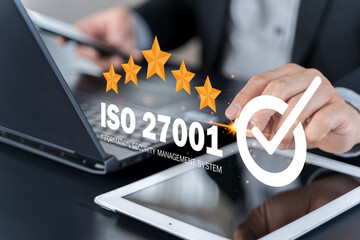 ISO 27001 concept. Businessman with ISO 27001 certified for information security management system.