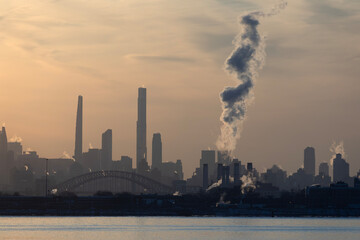 Power plant smoke stack and the New York City skyline	
