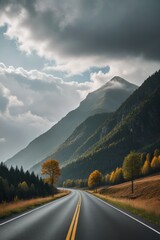 there is a long road with a yellow line going through the mountains