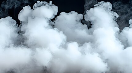 Obraz premium Dense White Smoke Forming Ethereal Shapes on Dark Background