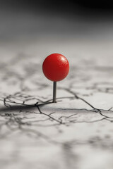 A bold red map pin casting a slight shadow, indicating a standout point of interest