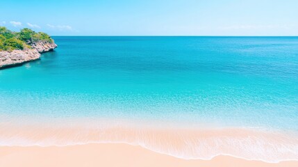 Obraz premium Serene tropical beach with clear turquoise water, soft sand, and lush greenery in the background