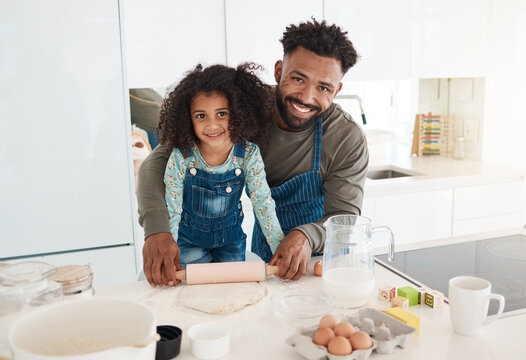 Baking, portrait and dad with child in kitchen with rolling pin to prepare cake, cookies or dessert. Family, happy and father with girl with ingredients, recipe and food for learning, bonding and fun