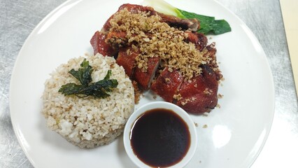 Golden Peking Duck Served with Fragrant Garlic Rice and Hoisin Glaze