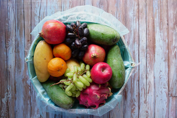 Basket filled with fresh fruits including apples and bananas