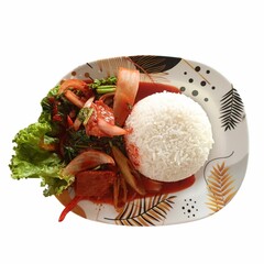 A plate of stir-fried rice with tender red meat, bursting with savory flavors. The rice is perfectly seasoned, mixed with fresh vegetables, and served hot, making it a delicious and satisfying meal.