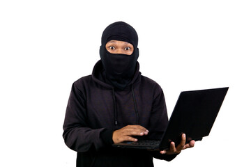 Shocked expression of male hacker holding laptop. Isolated on white background