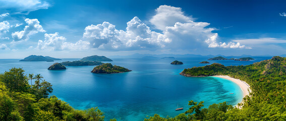 Fototapeta premium Stunning panoramic view of tropical islands and turquoise ocean under a bright blue sky with fluffy white clouds