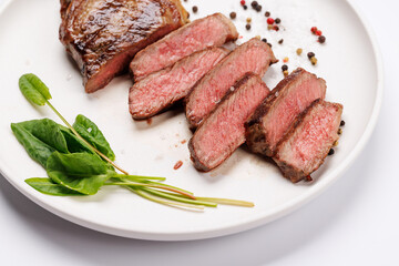 A perfectly cooked sliced striploin steak with a juicy, tender texture