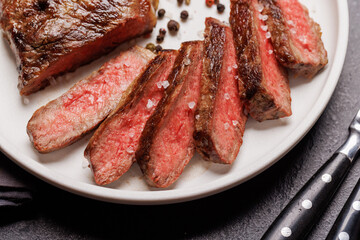 A perfectly cooked sliced striploin steak with a juicy, tender texture