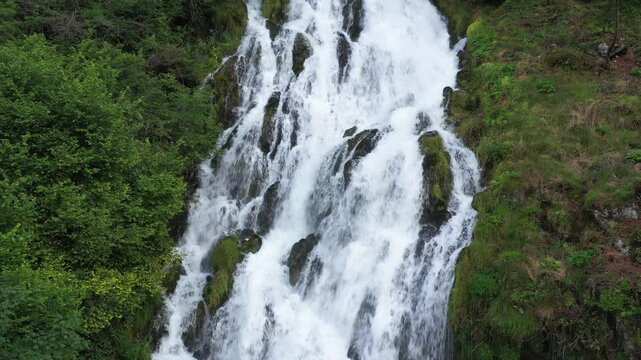 Untamed Alps: Drone View Capturing Cascading Falls in the Wild Outdoors