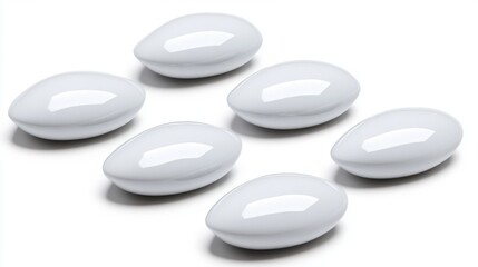 Collection of Six White Oval Capsules on a Clean Surface for Health and Wellness