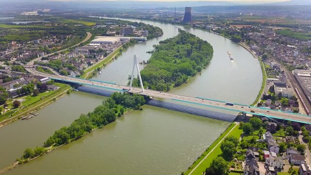 High view point of the Rhine bridge in Neuwied, Germany, showcasing a vital transport route with traffic moving steadily across, emphasizing the region's role in trade and logistics.