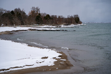 Snow-covered winter view of Centre Island Beach on Toronto Islands.