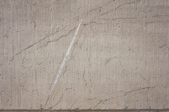 Fossil on limestone wall surface, Extinct genus of large, straight shelled cephalopods from Ordovician period, Ancient petrified invertebrate, Prehistoric orthocone mollusk