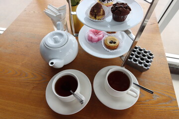 afternoon hitea tower with various delicious cake