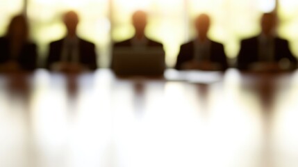 Blurred Silhouettes of Business Professionals in a Corporate Meeting Room Focusing on Strategy