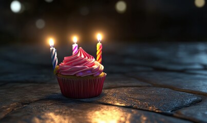 Festive cupcake with candles, nighttime setting, stone background; birthday celebration image