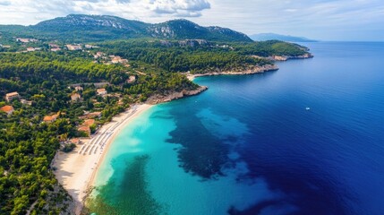 Peaceful aerial scene of a beach and coastline with blue waters